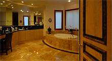 master bath is quite large with marble floors, double sinks, make-up area, jacuzzi tub, large, walk-in shower